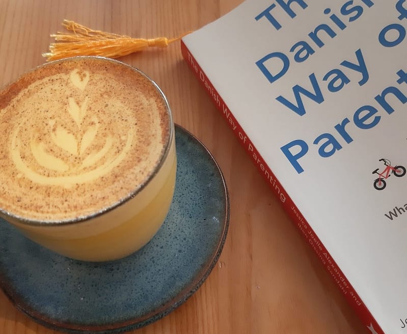 turmeric latte and a book