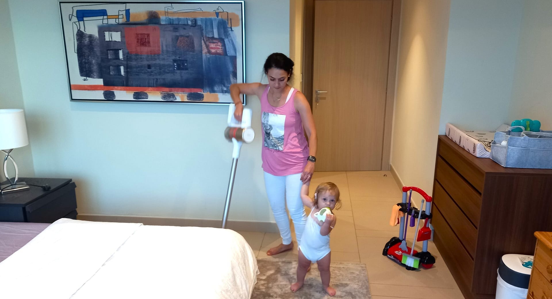 mother and daughter cleaning as time management multitasking technique for busy moms
